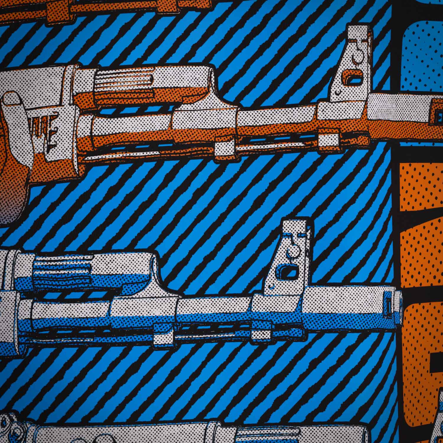 Close up of the print used on the 'A OK' Supreme Premium Graphic Street Fashion T-shirt on a Black organic natural fibre cotton top by Boondock Traders & Co. Streetwear, clothing and apparel brand, inspired by Anime and Manga Action Scnenes. Featuring stacked AK 47 guns pointing to the right. In a halftone, comic, manga and grafitti style.